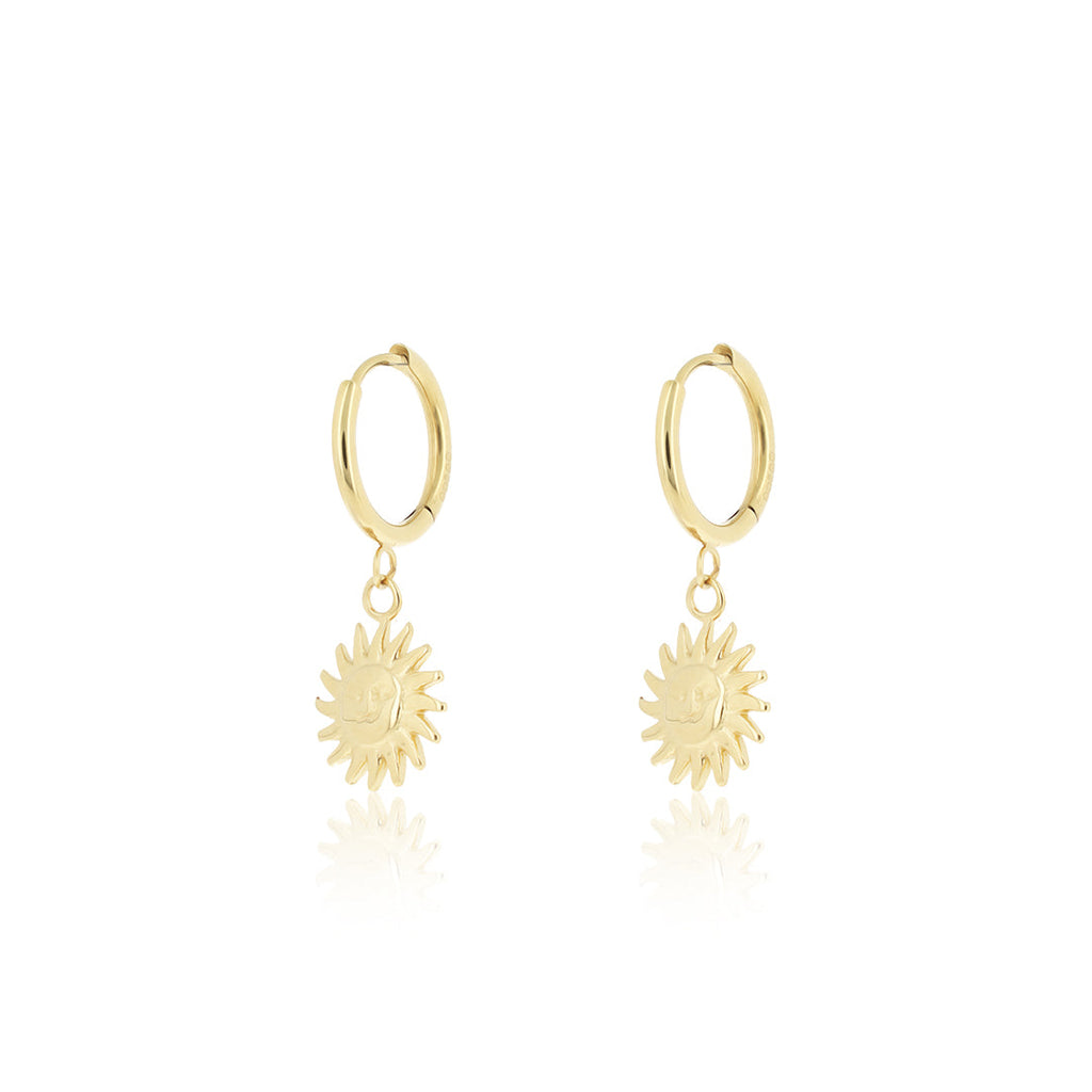 Gold hoop earrings with sun charm